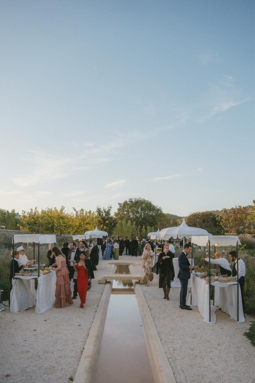 Guests gathering for aperitivo beside the Water Canale