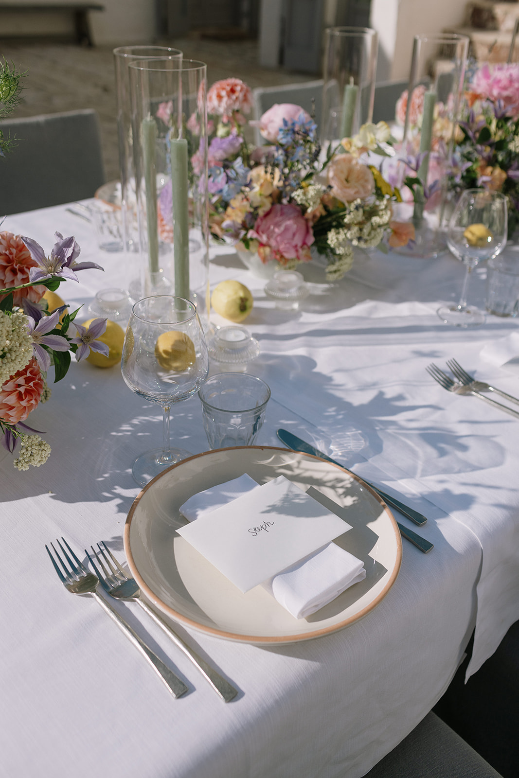 Flowers and place settings for a courtyard meal at Masseria Petrarolo