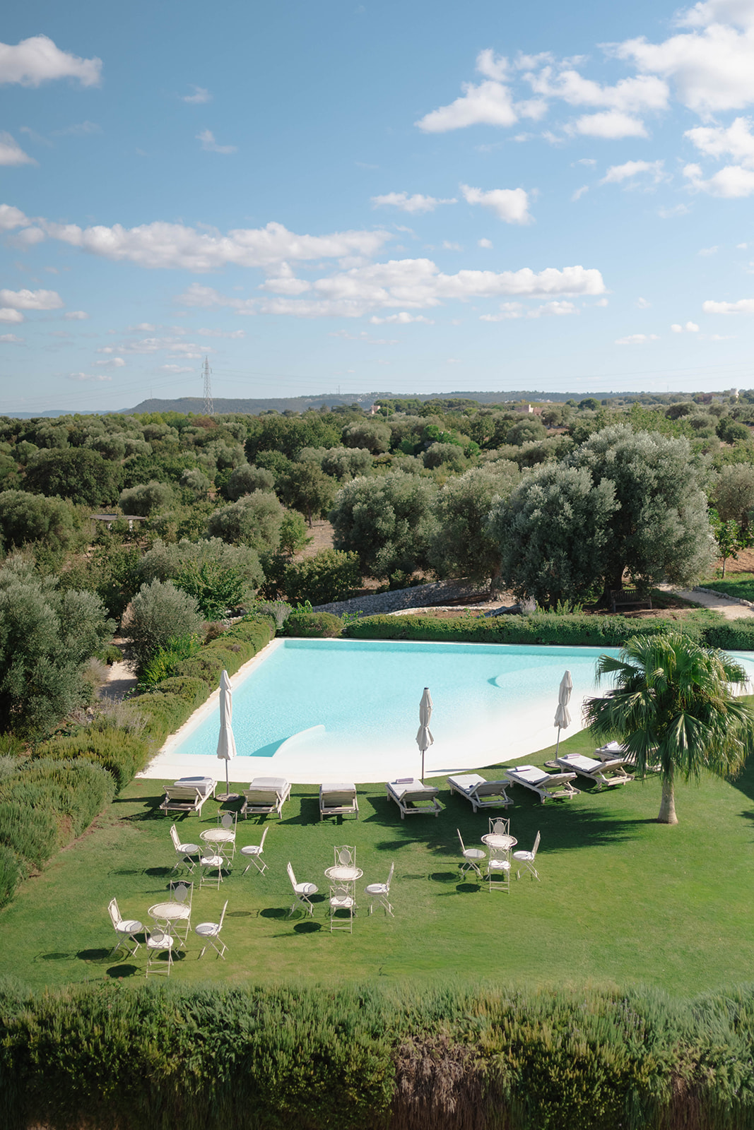 An elevated view of the pool and garden terraces