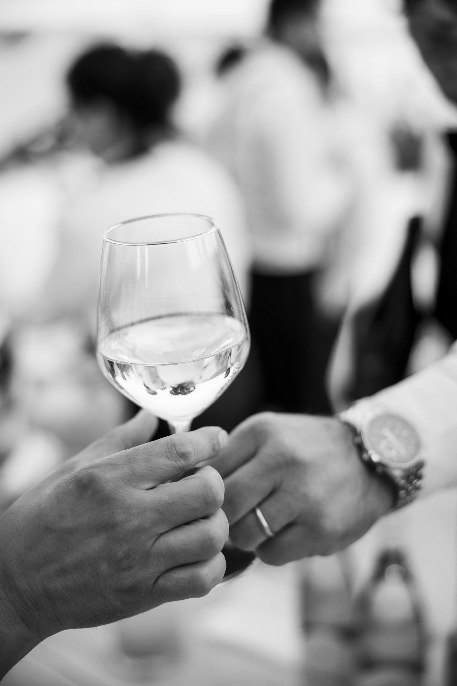 A glass of wine shared during the wedding reception